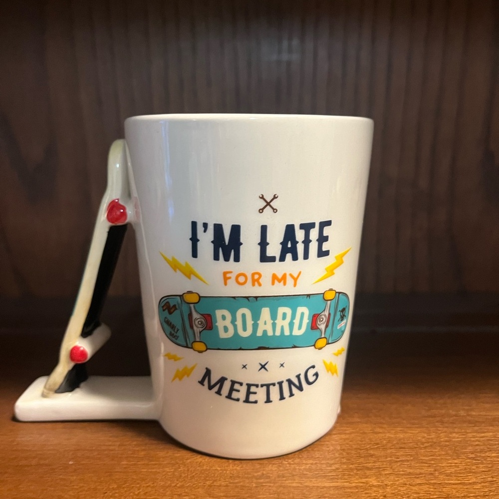 White Skateboard‎ Mug with Black Skateboard Handle. Holds 12oz.